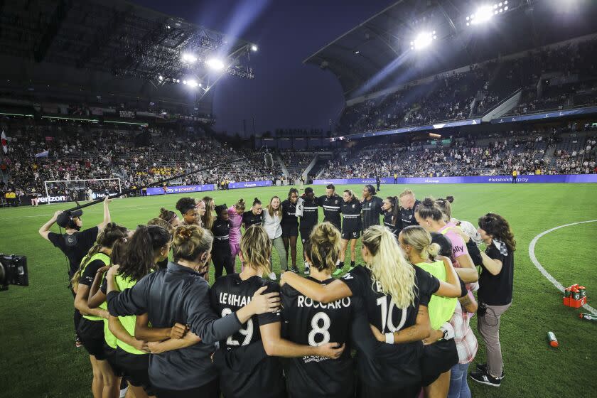 LOS ANGELES, CALIFORNIA - SEPTEMBER 25: Angel City FC huddles together after losing.