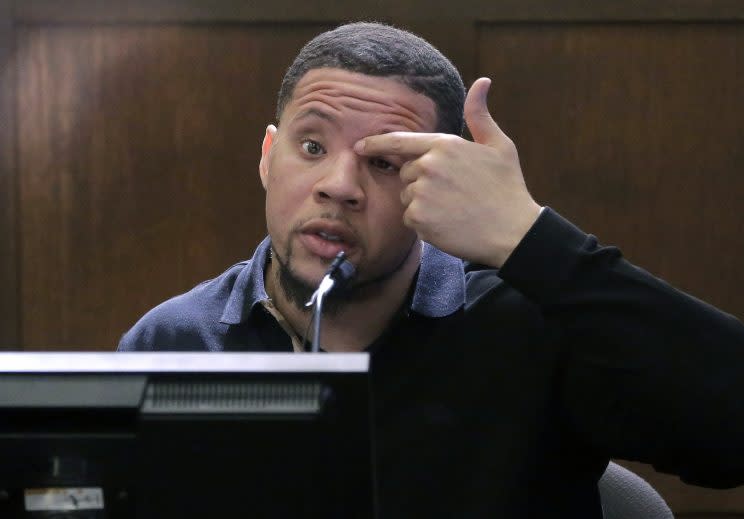 Alexander Bradley points to where he alleges Aaron Hernandez shot him in the face. (AP)