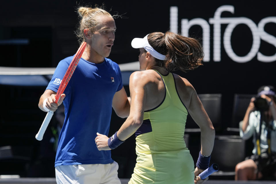 Brazil's Luisa Stefani and Rafael Matos react after winning a point against India's Rohan Bopanna and Sania Mirza in the mixed doubles final at the Australian Open tennis championship in Melbourne, Australia, Friday, Jan. 27, 2023. (AP Photo/Dita Alangkara)