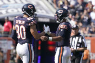 Chicago Bears tight end Jimmy Graham (80) celebrates with quarterback Justin Fields the team's 20-17 win over the Cincinnati Bengals after an NFL football game Sunday, Sept. 19, 2021, in Chicago. (AP Photo/David Banks)