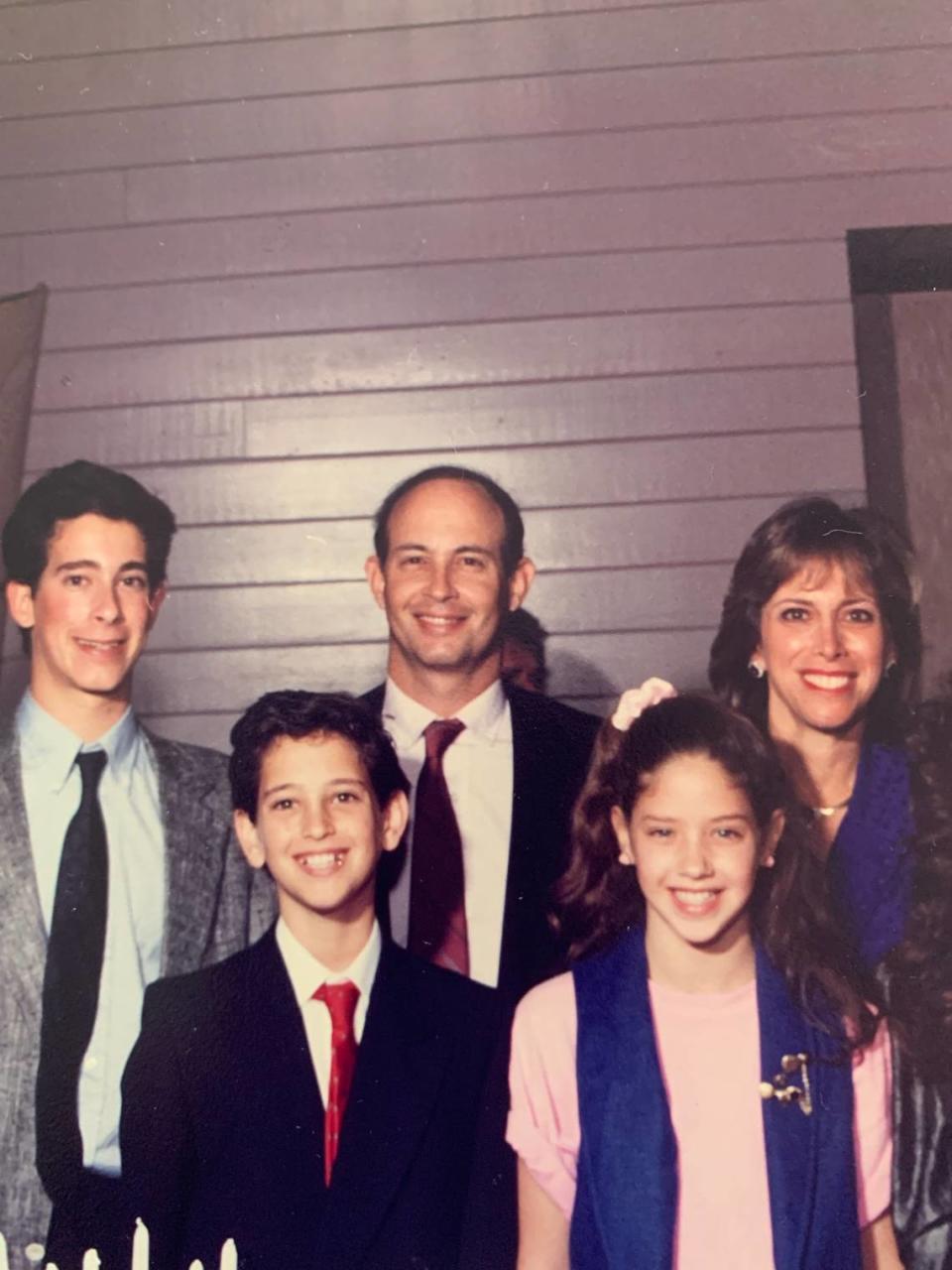 The Adelson family in happier times when they lived in Coral Springs. From left in an undated photo: Robert, Charles, Harvey, Wendi, Donna.