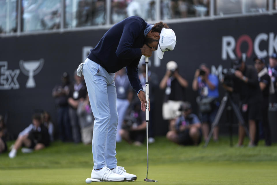 Akshay Bhatia reacts to missing a par putt on the 18th green during the final round of the Rocket Mortgage Classic golf tournament at Detroit Country Club, Sunday, June 30, 2024, in Detroit. (AP Photo/Paul Sancya)