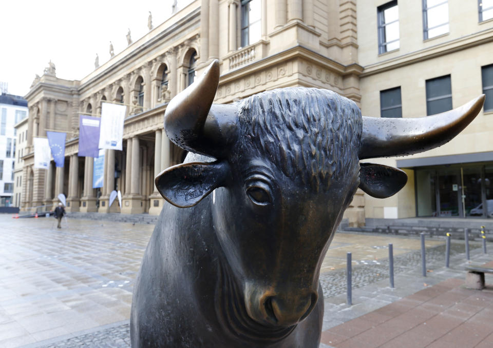 FILE - In this Feb. 23, 2016 file photo the bull statue stands in front of the stock market in Frankfurt, Germany. The European Union blocked the proposed merger of Germany's Deutsche Boerse and the London Stock Exchange on Wednesday, March 29, 2017 saying that it had 