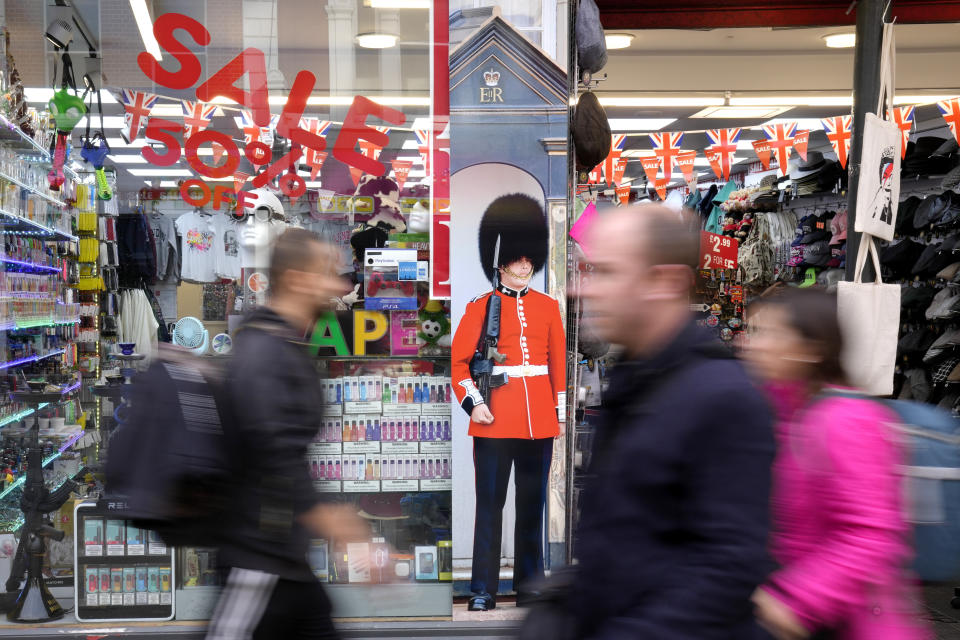 FILE - Pedestrians pass a souvenir shop on Oxford Street in London, on Nov. 11, 2022. Britain’s inflation rate rose to a 41-year high in October, fueling demands for the government to do more to ease the nation’s cost-of-living crisis when it releases new tax and spending plans on Thursday, Nov. 17, 2022. (AP Photo/Kirsty Wigglesworth, File)