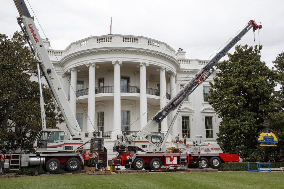 <p>Cranes are positioned in front of the South Portico of the White House in Washington, Friday, Aug. 11, 2017, during renovations while President Donald Trump is spending time at his golf resort in New Jersey. (AP Photo/J. Scott Applewhite) </p>