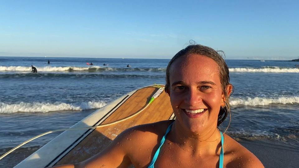 Carleigh Schlissel, a University of Rhode Island student and novice surfer, is cautious about how big the waves will become as Hurricane Lee approaches the Rhode Island coast.