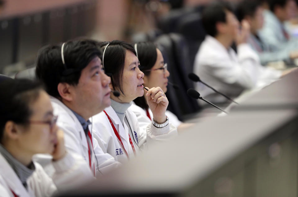 Technicians work at the Beijing Aerospace Control Center in Beijing Friday, Jan. 11, 2019. China on Friday broadcast pictures taken by its rover and lander on the moon's far side, in what its space program hailed as another triumph for the groundbreaking mission to the less-understood sector of the lunar surface. (Jin Liwang/Xinhua via AP)