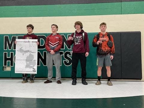 Jonesville wrestler Tyler Milks (right) took fourth place in his weight class to qualify for the 2023 state finals.