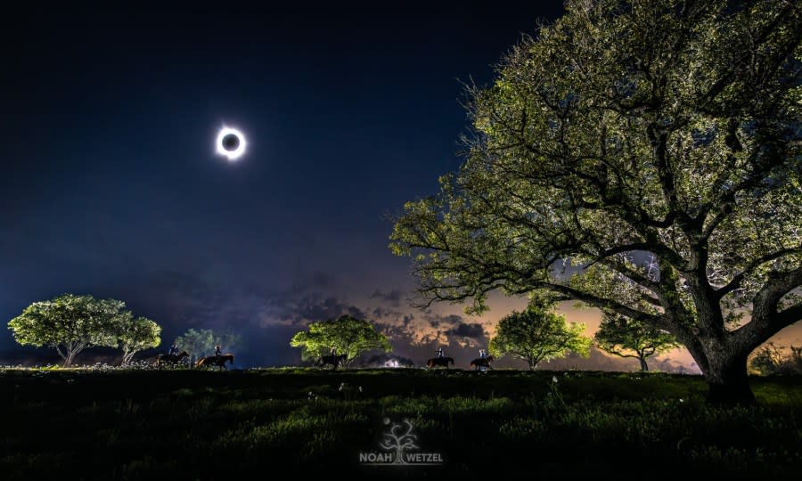 The Morris family riding on horseback below a total solar eclipse at 4M Morris Ranch in Llano County, Texas, on April 8, 2024. (Courtesy Noah Wetzel Photography)