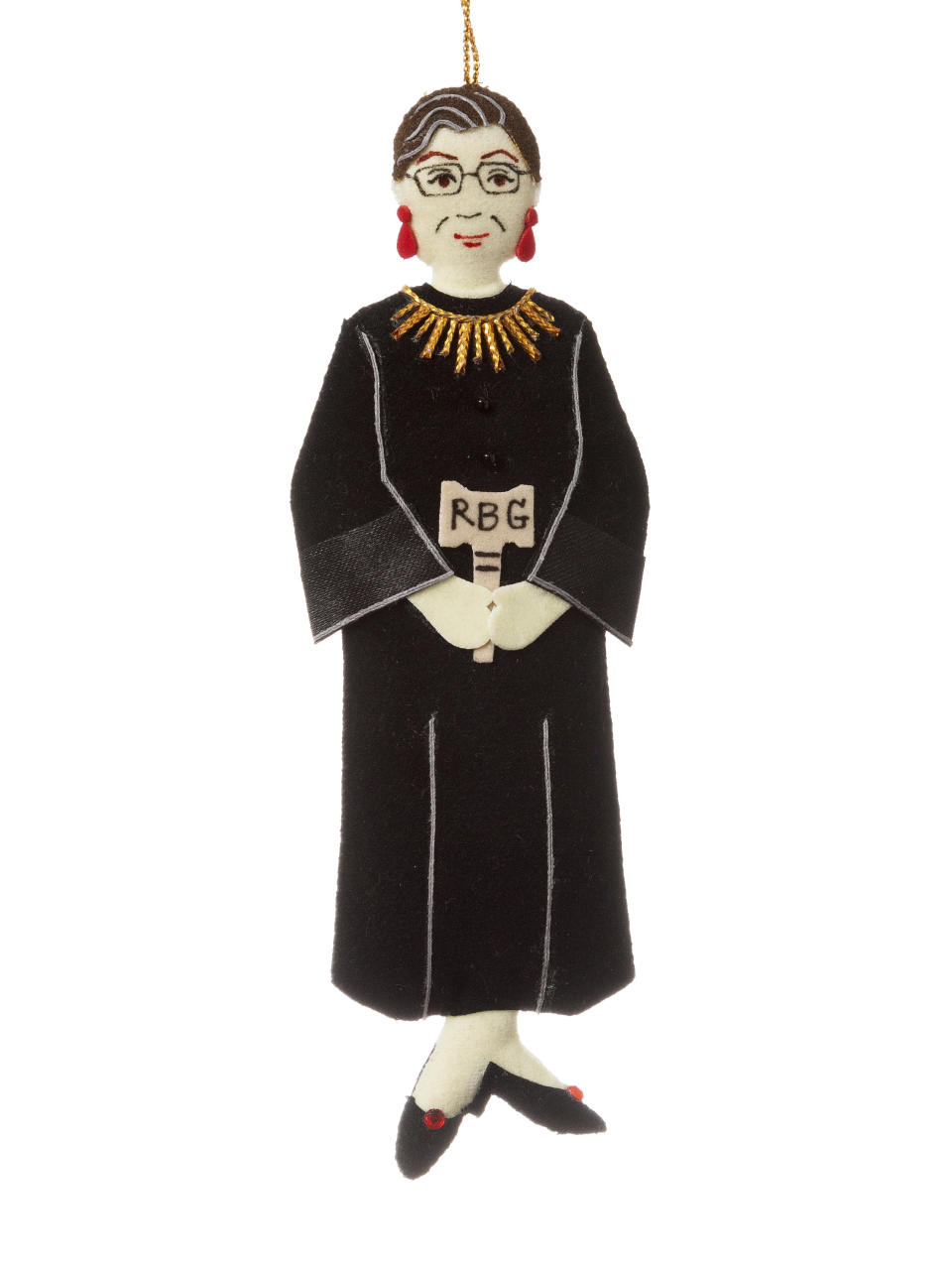 This image shows a 6.5-inch-high ornament in the image of the late Supreme Court justice Ruth Bader Ginsburg. The item is handmade by disadvantaged rural women in Thailand and hangs from a gold cord and sells for $14.95. (New York Historical Society & Library via AP