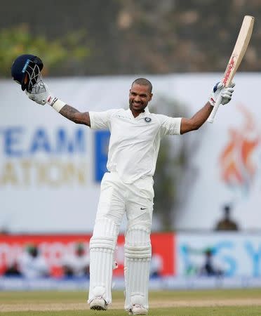 Cricket - Sri Lanka v India - First Test Match - Galle, Sri Lanka - July 26, 2017 - India's cricketer Shikhar Dhawan celebrates his century. REUTERS/Dinuka Liyanawatte