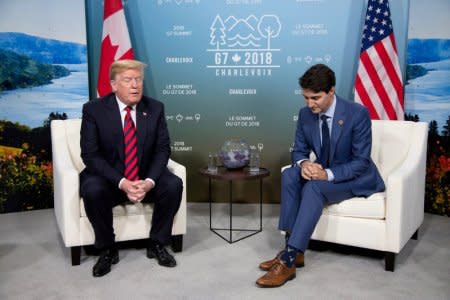 FILE PHOTO: Canada's Prime Minister Justin Trudeau (R) meets with U.S. President Donald Trump during the G7 Summit in the Charlevoix town of La Malbaie, Quebec, Canada, June 8, 2018. Photo taken June 8, 2018. REUTERS/Christinne Muschi/File Photo