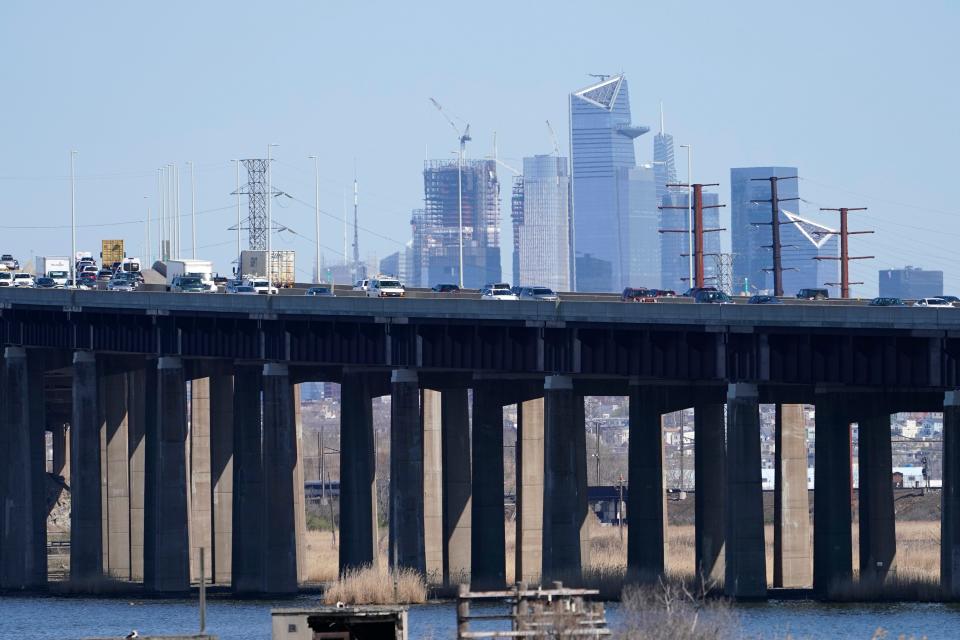 Cars travel on a raised expressway in Kearny, N.J., Tuesday, April 6, 2021. President Joe Biden is setting about convincing the nation it needs his $2.3 trillion infrastructure plan, deputizing a five-member "jobs Cabinet" to help in the effort.