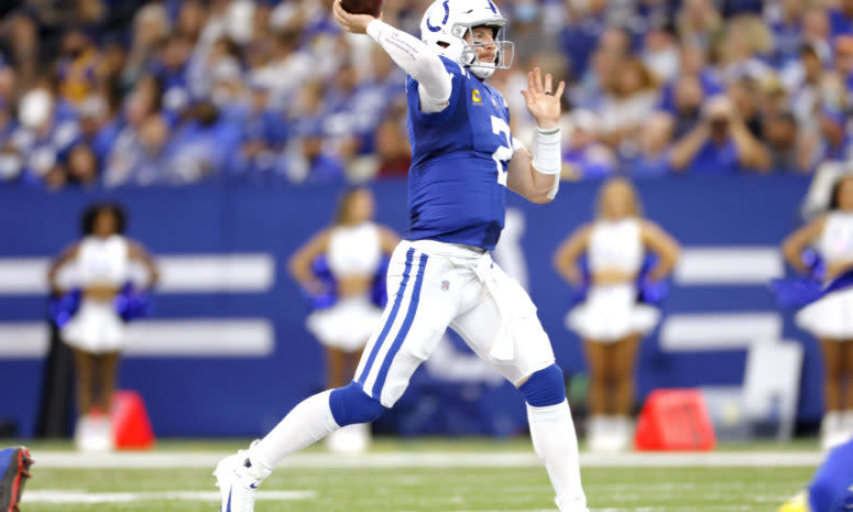 Colts quarterback Carson Wentz throws a pass in a game.