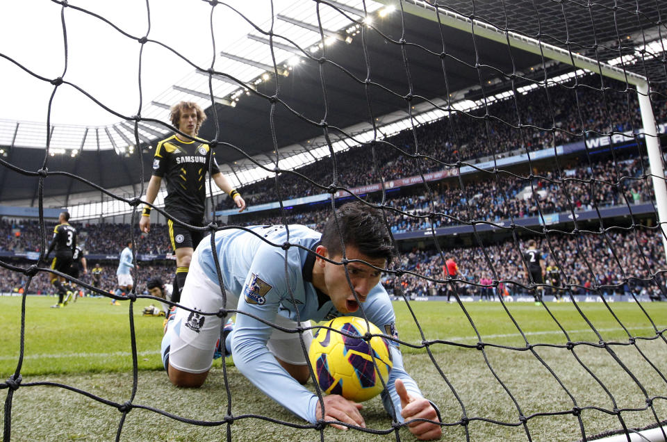 Manchester City's Sergio Aguero celebrates a goal scored by teammate Yaya Toure during their English Premier League soccer match against Chelsea at The Etihad Stadium in Manchester, northern England, February 24, 2013. REUTERS/Darren Staples (BRITAIN - Tags: SPORT SOCCER TPX IMAGES OF THE DAY) FOR EDITORIAL USE ONLY. NOT FOR SALE FOR MARKETING OR ADVERTISING CAMPAIGNS. NO USE WITH UNAUTHORIZED AUDIO, VIDEO, DATA, FIXTURE LISTS, CLUB/LEAGUE LOGOS OR "LIVE" SERVICES. ONLINE IN-MATCH USE LIMITED TO 45 IMAGES, NO VIDEO EMULATION. NO USE IN BETTING, GAMES OR SINGLE CLUB/LEAGUE/PLAYER PUBLICATIONS - RTR3E7M2