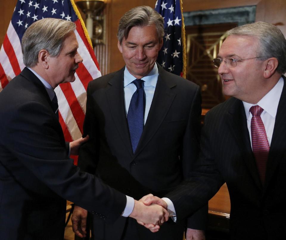 Canada's Ambassador to the US Gary Doer, center, stands with Sen. John Hoeven, R-N.D., left, and American Petroleum Institute (API) President and CEO Jack N. Gerard, at the end of a news conference on Capitol Hill in Washington, Tuesday, Feb. 4, 2014, regarding the approval of the Keystone XL pipeline. (AP Photo/Charles Dharapak)