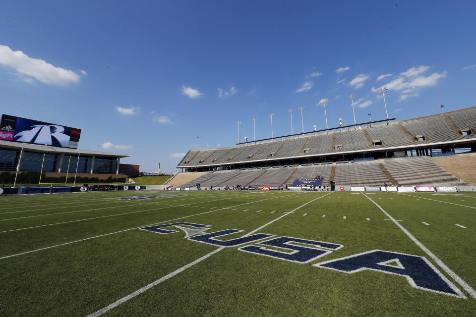 FILE - In this Sept. 6, 2019, file photo, The Conference USA logo is displayed on the field Rice Stadium before an NCAA football game in Houston. Six schools from Conference USA — UAB, UTSA, Rice, North Texas, Charlotte and Florida Atlantic — have applied for membership with the American Athletic Conference and are expected to be accepted by the end of the week, according to two people with knowledge of the process who spoke with The Associated Press, Wednesday, Oct. 20, 2021. (AP Photo/Matt Patterson, File)