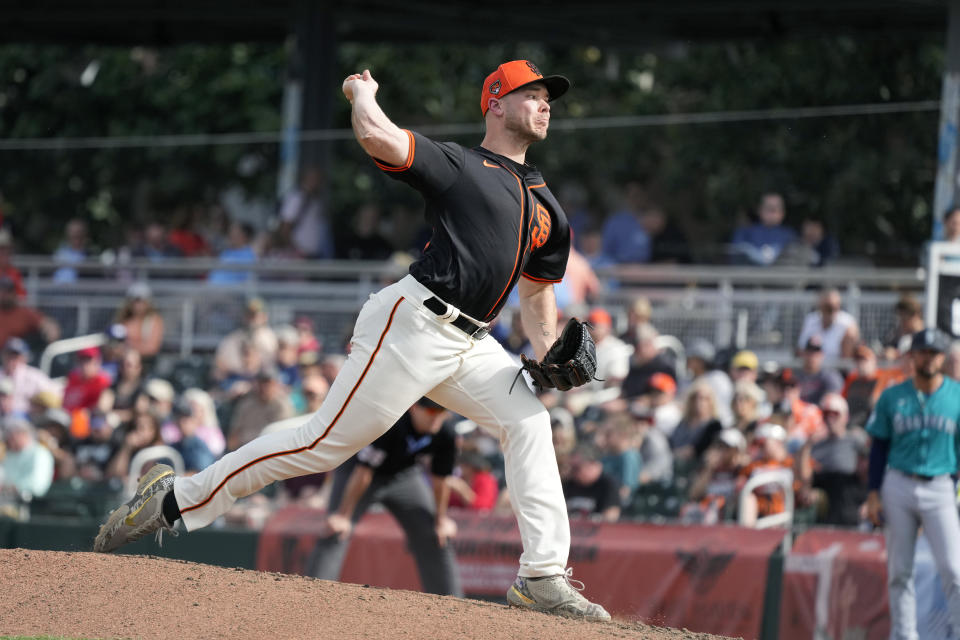 San Francisco Giants pitcher Daulton Jefferies throws against the Seattle Mariners during the fifth inning of a spring training baseball game Tuesday, Feb. 27, 2024, in Scottsdale, Ariz. Jefferies is trying to come back from a second Tommy John surgery at age 28. (AP Photo/Ross D. Franklin)