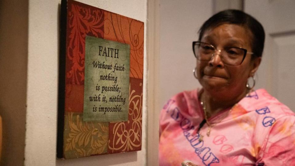 Above the floors that are now slanted from decades of flooding with sewage-contaminated water, Cahokia Heights resident Yvette Lyles hangs a sign that reads “Without faith nothing is possible; with it, nothing is impossible.”