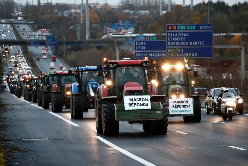 French farmers drive on the A6 motorway during a protest on their way to Paris