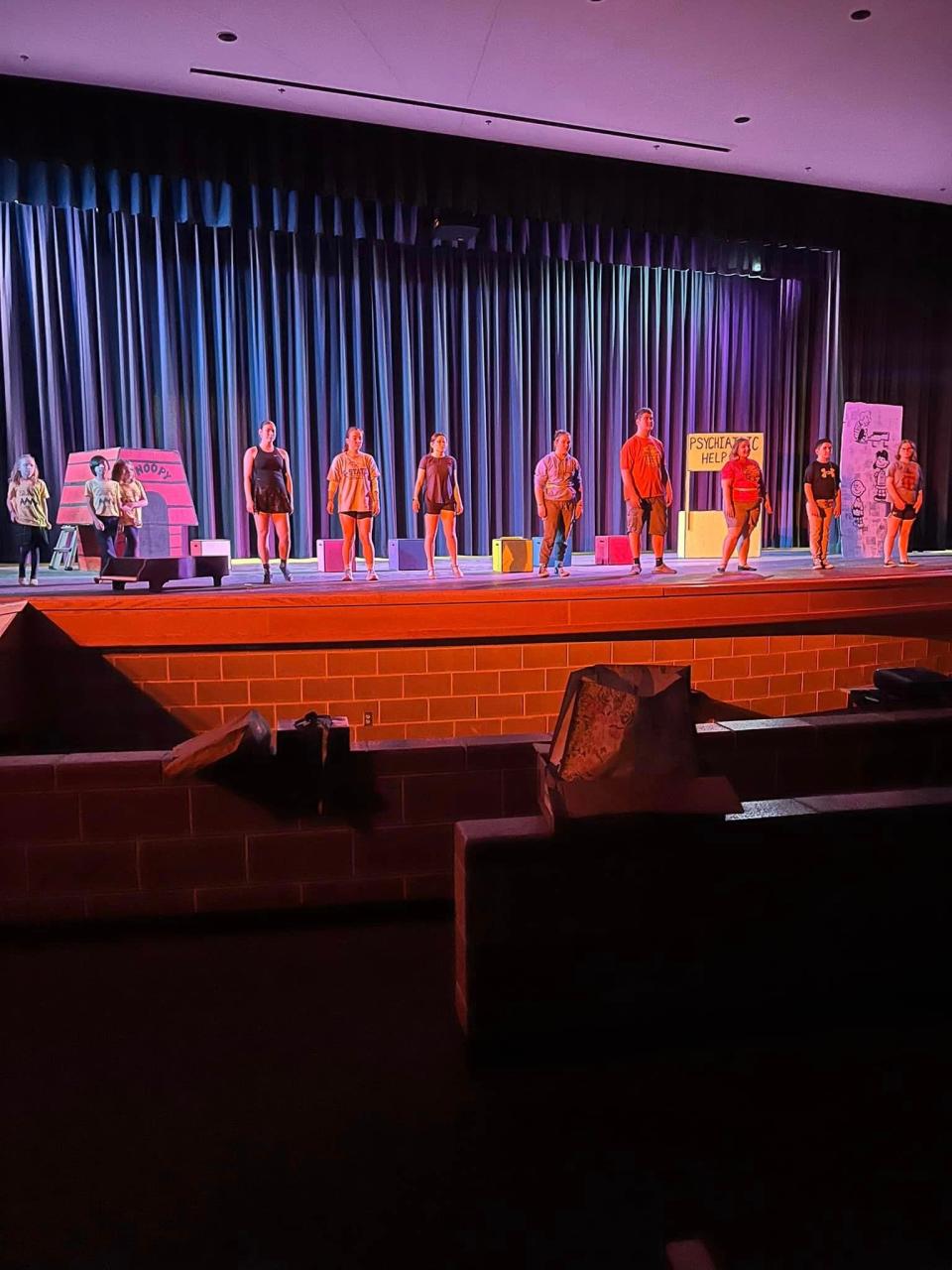 Performers in Sacred Heart's production of "You're a Good Man Charlie Brown" work on blocking at Salina South High School in the afternoon before it opened. The show was moved to the different venue after a tragedy at Kansas Wesleyan canceled events on its campus.