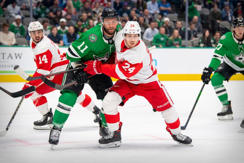 Red Wings center Robby Fabbri, left, and center Pius Suter and Dallas Stars center Luke Glendening look for the puck during the first period on Tuesday, Nov. 16, 2021, in Dallas.