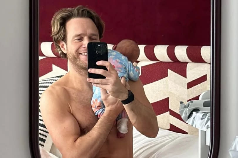 Olly Murs takes a selfie with his newborn baby