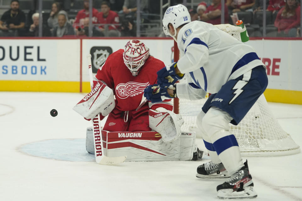 Detroit Red Wings goaltender Alex Nedeljkovic (39) stops a Tampa Bay Lightning right wing Corey Perry (10) shot in the first period of an NHL hockey game Thursday, Oct. 14, 2021, in Detroit. (AP Photo/Paul Sancya)