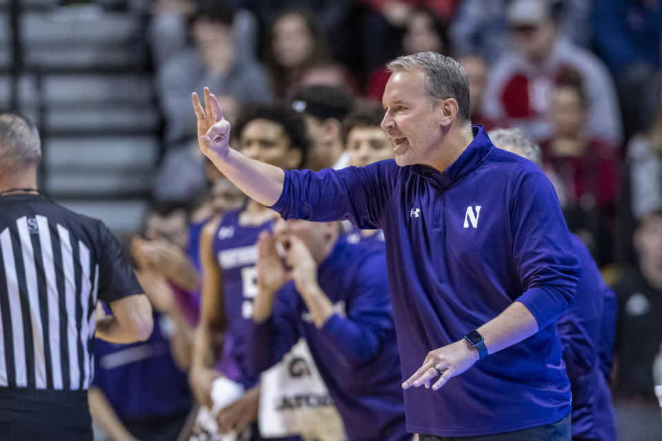 Northwestern head coach Chris Collins gestures during the first half an NCAA college basketball game against Indiana, Sunday, Jan. 8, 2023, in Bloomington, Ind. (AP Photo/Doug McSchooler)