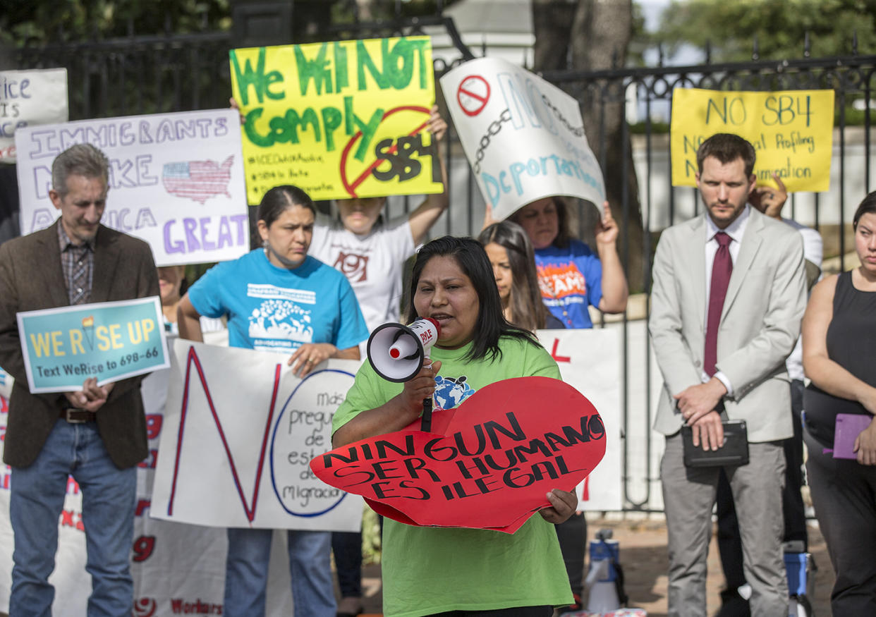 Maria Duque leads a protest