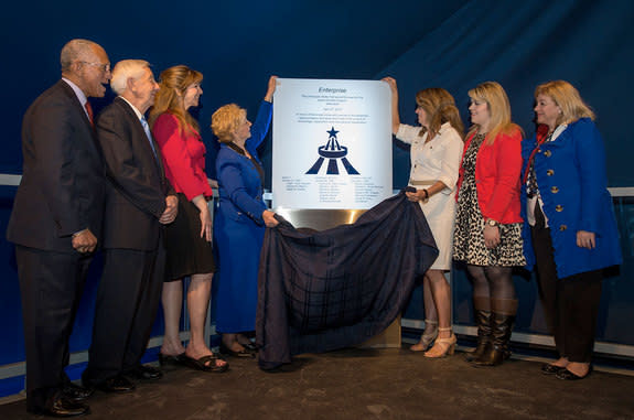 June Scobee Rodgers and Sheryl Chaffee help to reveal a plaque dedicating the Intrepid Sea Air & Space Museum's exhibit of the space shuttle Enterprise to the fallen Apollo 1, STS-51L and STS-107 astronauts, including their family members. With