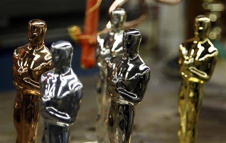 Oscar statuettes in the five steps of manufacturing, (from L to R) Copper, Britannia Pewter Base, Nickel, Silver and 24 Karat Gold, are seen during a media tour of the R.S. Owen and Company in Chicago in this February 9, 2012 file photo. REUTERS/Jeff Haynes/Files