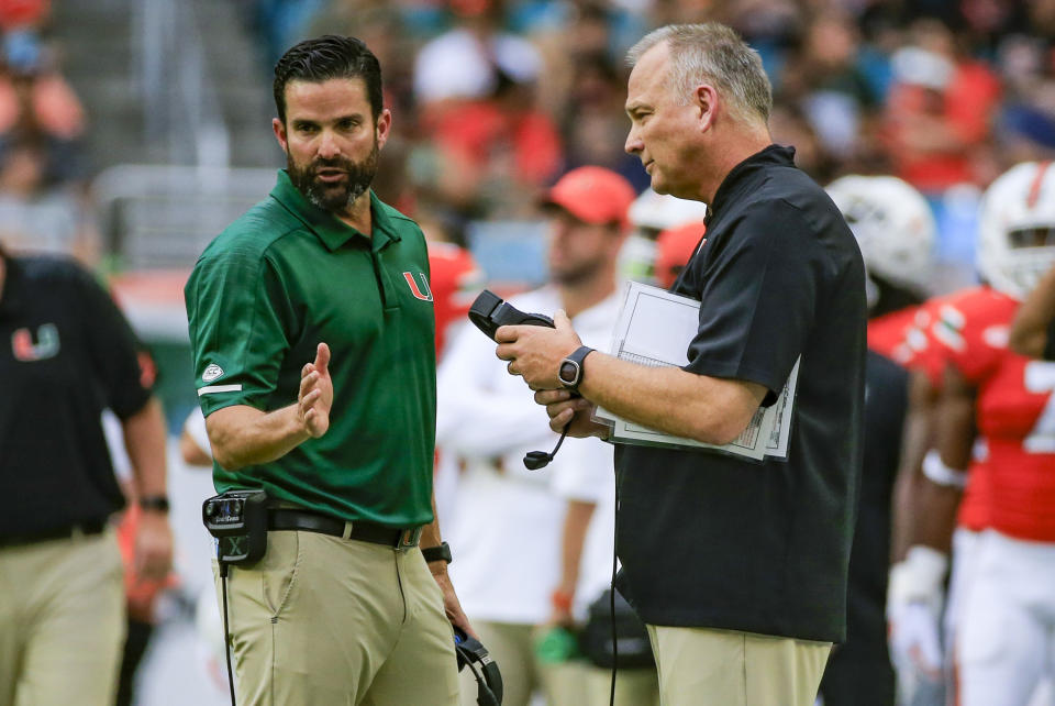 Miami head coach Mark Richt, right, and defensive coordinator Manny Diaz talk on the sidelines during the first quarter against Pittsburgh at Hard Rock Stadium in Miami Gardens, Fla., on Saturday, Nov. 24, 2018. The host Hurricanes won, 24-3. (Getty)