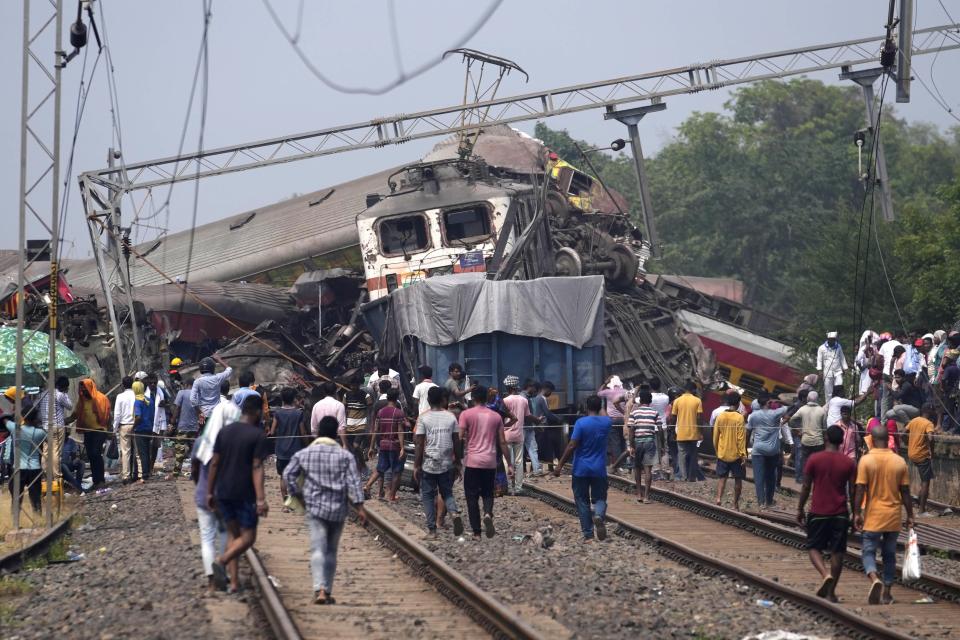 Rescuers work at the site of passenger trains that derailed in Balasore district, in the eastern Indian state of Orissa, Saturday, June 3, 2023. Rescuers are wading through piles of debris and wreckage to pull out bodies and free people after two passenger trains derailed in India, killing more than 280 people and injuring hundreds as rail cars were flipped over and mangled in one of the country’s deadliest train crashes in decades. (AP Photo/Rafiq Maqbool)