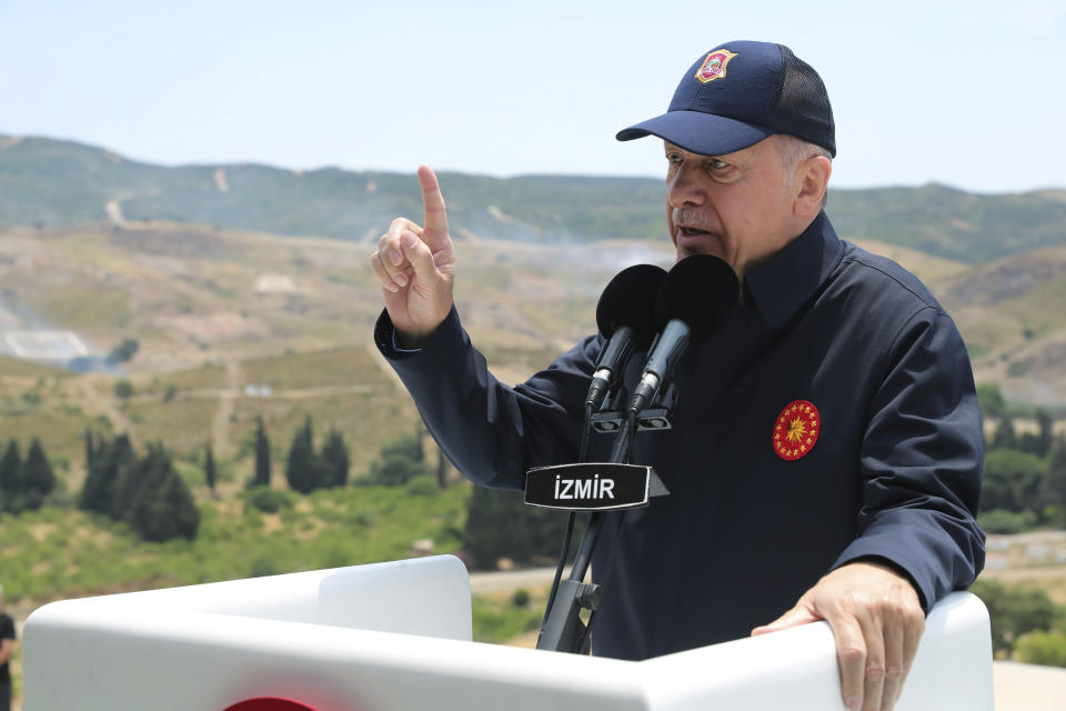 In this handout photo provided by the Turkish Presidency, Turkish President Recep Tayyip Erdogan speaks during the final day of military exercises that were taking place in Seferihisar near Izmir, on Turkey's Aegean coast, Thursday, June 9, 2022. Erdogan on Thursday warned Greece to demilitarize islands in the Aegean, saying he was "not joking" with such comments. Turkey says Greece has been building a military presence on Aegean in violation of treaties that guarantee the unarmed statues of the islands. (Turkish Presidency via AP)