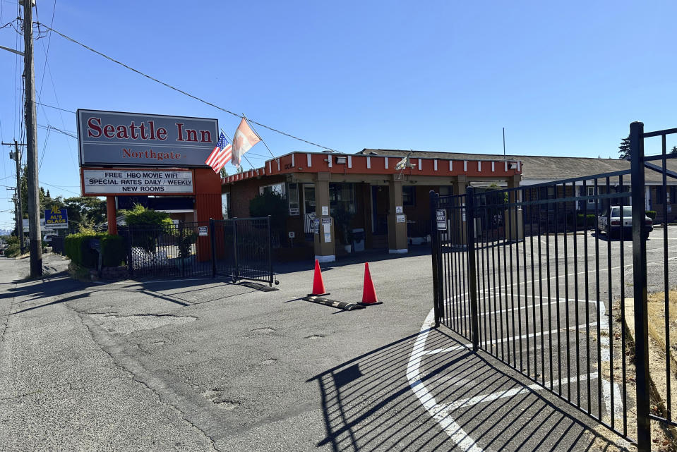 The Seattle Inn sits on Aurora Avenue North in Seattle, on Thursday, Aug. 3, 2023. Police recently declared the establishments to be chronic nuisances due to rampant prostitution and other criminal activity, a step that requires the owners to demonstrate how they will prevent their properties from being used for criminal behavior. The recent harrowing escape of a woman who was abducted after engaging in prostitution on Seattle has helped focus attention on the consequences of tolerating an open sex trade along the thoroughfare. (AP Photo/Gene Johnson)