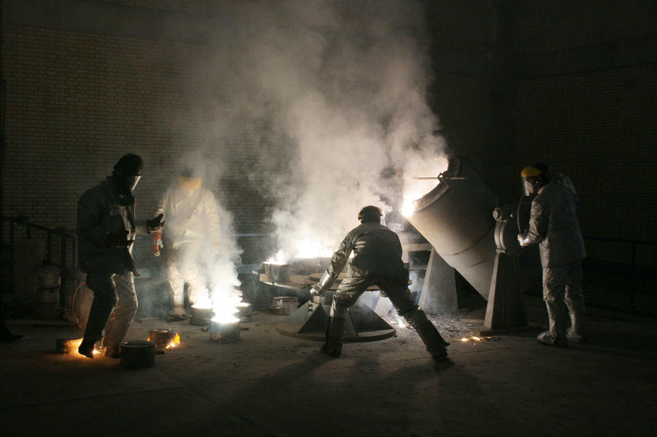 Men work inside of an uranium conversion facility March 30, 2005, outside the city of Isfahan, about 254 miles (410 kilometers) south of capital Tehran, Iran. The cities of Isfahan and Natanz in central Iran are home to the heart of Iran’s nuclear program. (Photo: Getty Images)