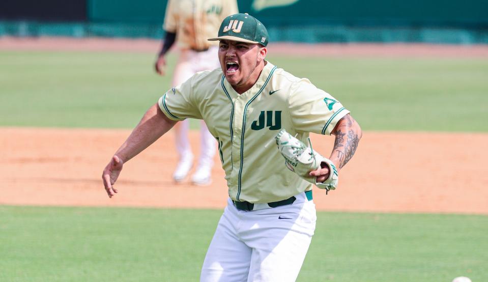 Jacksonville University relief pitcher Divine Valle celebrates the final out on Sunday in a 9-6 victory over the University of North Florida, at John Sessions Stadium.