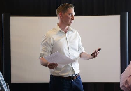 Jeremy Price, Alaska State Director of Americans for Prosperity, addresses the audience during an organizing meeting in a restaurant in Anchorage, Alaska June 24, 2015. REUTERS/Mark Meyer