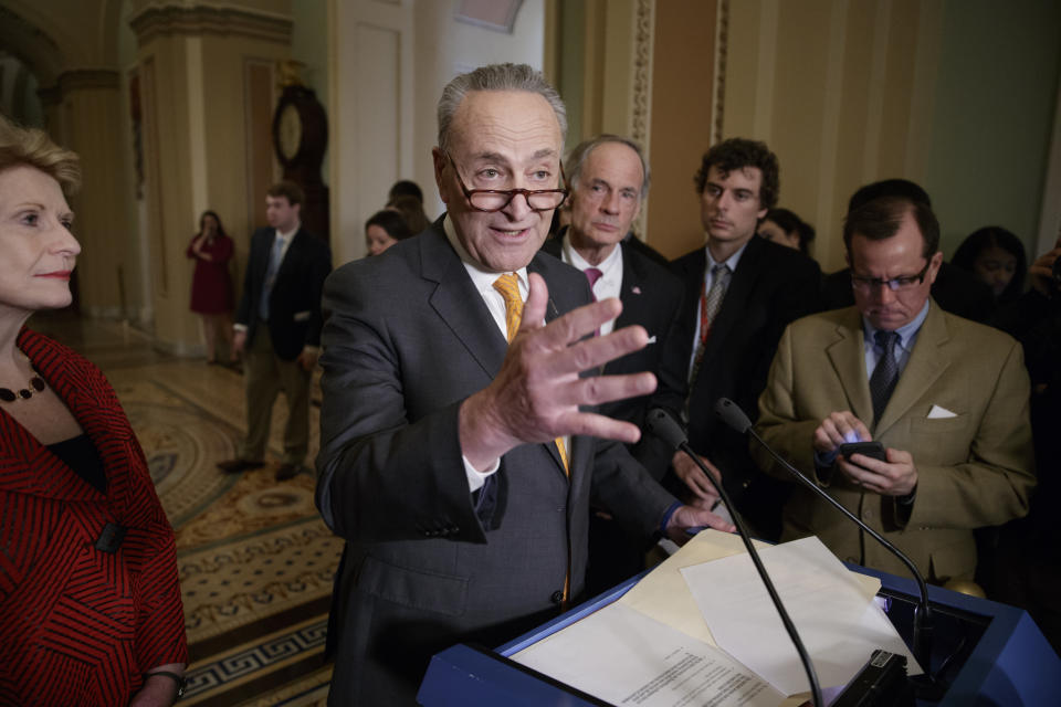 Senate Minority Leader Charles Schumer of N.Y., flanked by Sen. Debbie Stabenow, D-Mich., left, and Sen. Tom Carper, D-Del., right rear, speaks with reporters following a closed-door strategy session, Tuesday, March 28, 2017, on Capitol Hill in Washington. (AP Photo/J. Scott Applewhite)