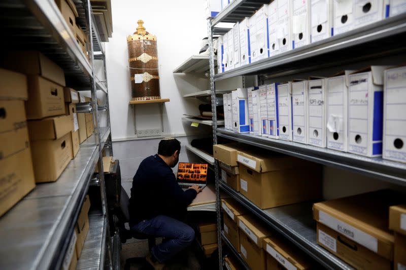 Assaf Fassy, Digital Services Manager for Shem Olam Holocaust Memorial Centre, looks at their digital photo database at their offices in Kfar Haroeh, Israel