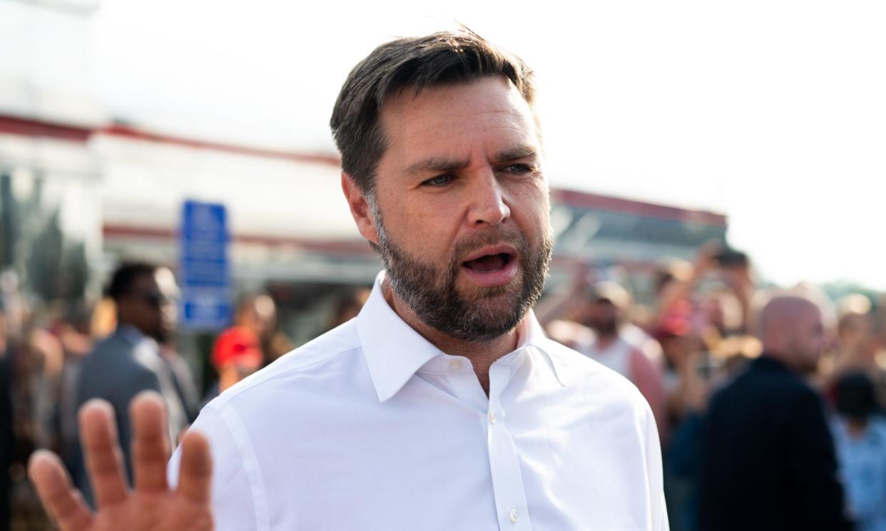 <span>JD Vance speaks with media gathered outside the Park Diner on Sunday in St Cloud, Minnesota.</span><span>Photograph: Stephen Maturen/Getty Images</span>