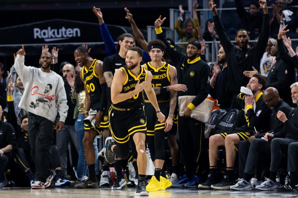 Golden State Warriors guard Stephen Curry (30) reacts after hitting a three-point shot against the Phoenix Suns during the first half at Chase Center in San Francisco on Feb. 10.