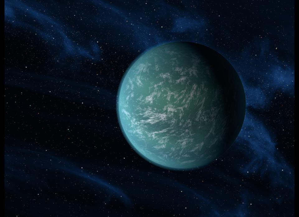 This Dec. 5, 2011, NASA illustration shows Kepler-22b, a planet known to comfortably circle in the habitable zone of a sun-like star. For the first time, NASA's Kepler mission has confirmed a planet to orbit in a star's habitable zone, the region around a star where liquid water, a requirement for life on Earth, could persist. The planet is 2.4 times the size of Earth, making it the smallest yet found to orbit in the middle of the habitable zone. Clouds could exist in this Earth's atmosphere, as the artist's interpretive illustration depicts.&nbsp;