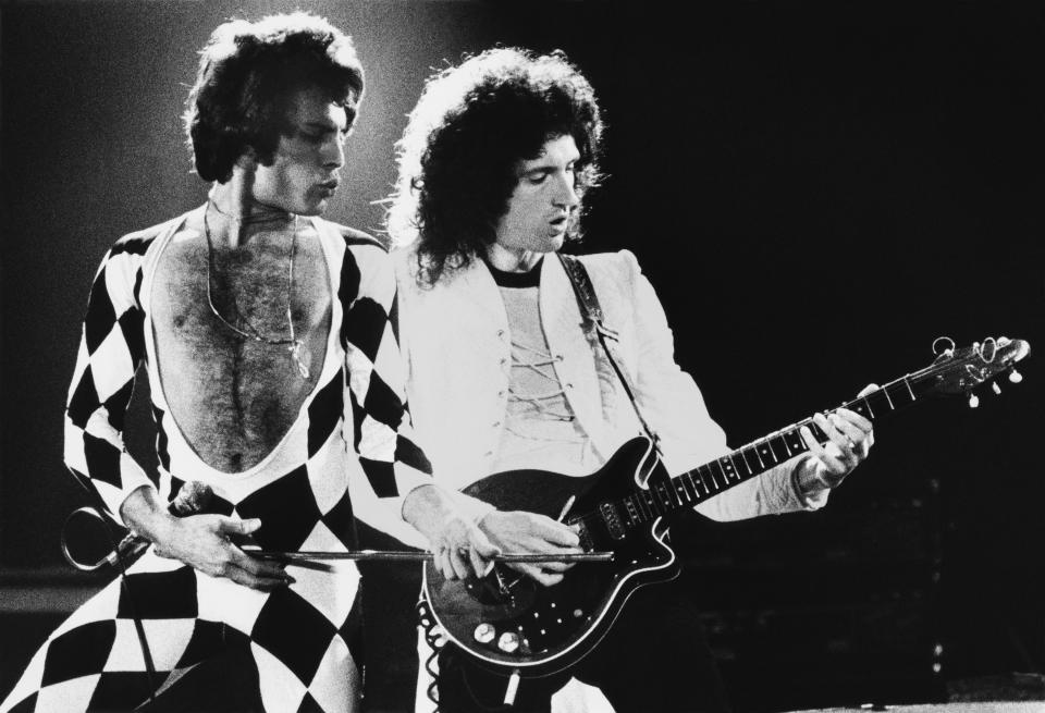 INGLEWOOD, CA – 1978: Singer Freddie Mercury and guitarist Brian May of the rock group Queen perform “We Are The Champions” onstage during a 1978 Inglewood, California, concert at the Forum. (Photo by George Rose/Getty Images)