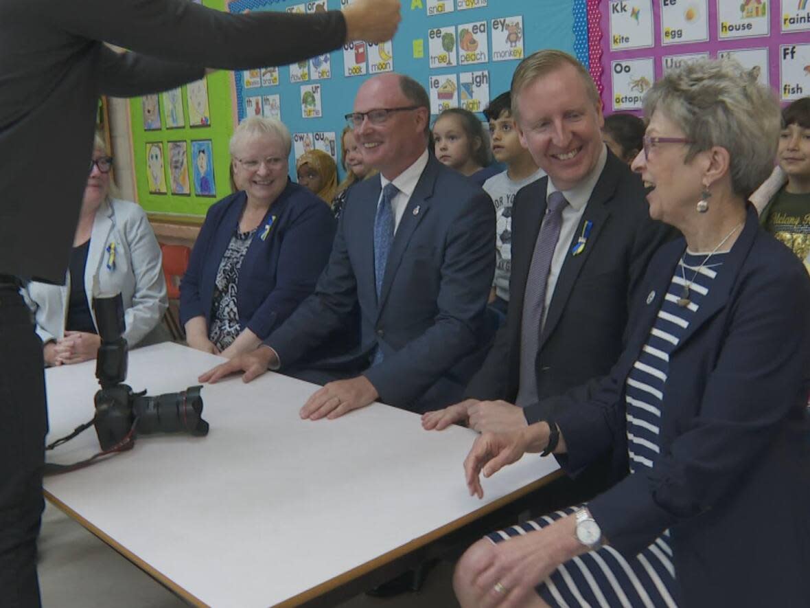 Provincial ministers pose for a photograph after announcing $3 million over two years for a literacy program. (Graham Thompson/CBC - image credit)