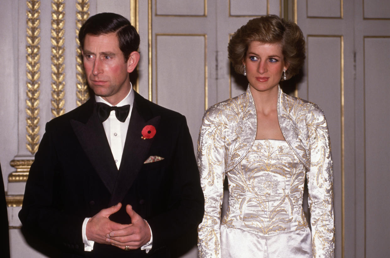 PARIS - NOVEMBER:  Prince Charles and Diana Princess of Wales meet guests arriving at a dinner in the Elysee Palace in Paris, France in November 1988, during the Royal Tour of France. Diana wore a dress designed by Victor Edelstein.(Photo by David Levenson/Getty Images)