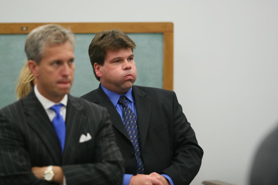 Defendant David Stewart blew a breath of relief after the jury found him not guilty in the Mount Washington McDonald's hoax call that resulted in Louise Ogborn, 18, being strip-searched and sexually assaulted. His attorney, Steve Romines, stood at left.