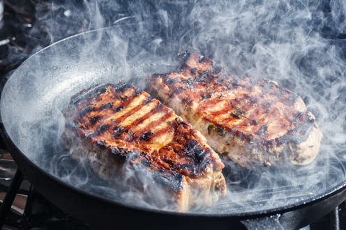   <span class="attribution"><a class="link " href="https://www.shutterstock.com/image-photo/smoke-rises-above-pork-steaks-pepper-1028342317" rel="nofollow noopener" target="_blank" data-ylk="slk:Olga Soloveva/Shutterstock;elm:context_link;itc:0;sec:content-canvas">Olga Soloveva/Shutterstock</a></span>