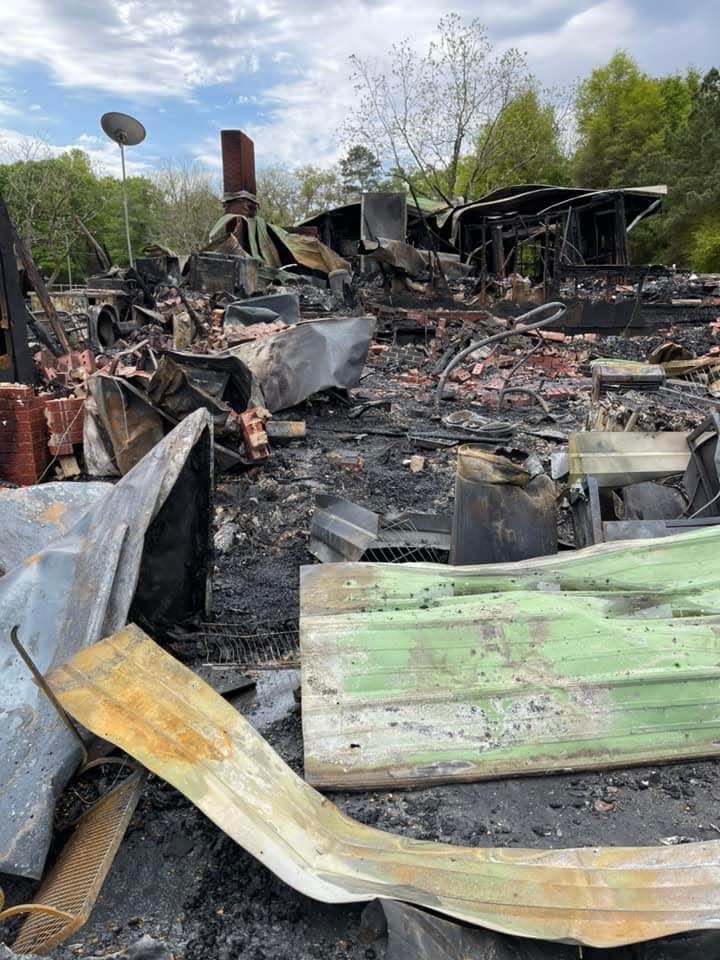 Debris litters Steve and Beth Brant's property on Old River Road in Baker after a fire April 11. The couple lost everything.